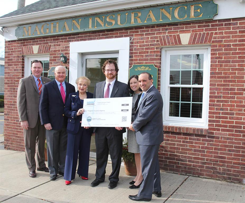 The Ross Maghan Agency owner Ross Maghan III and Mara Pellish-Maghan accepted the Façade Improvement Program check from Freeholder Thomas A. Arnone, Freeholder Director Lillian G. Burry, Freeholder John P. Curley and Assemblyman Robert D. Clifton. Pictured left to right: Assemblyman Robert D. Clifton, Freeholder John P. Curley, Freeholder Director Lillian G. Burry, Ross Maghan III, Mara Pellish-Maghan and Freeholder Thomas A. Arnone.